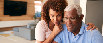 Older black couple sitting together